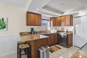 House, Multiple Beds, Patio, Garden View (Ocean Song House) | Private kitchen | Fridge, microwave, oven, stovetop - Ocean Song House (Fort Pierce)