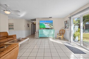 House, Multiple Beds, Patio, Garden View (Ocean Song House) | Living area | 42-inch flat-screen TV with digital channels - Ocean Song House (Fort Pierce)