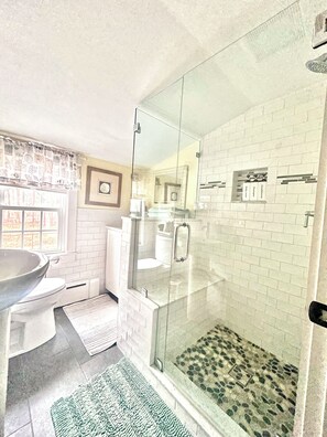 Shower, hair dryer, towels, soap