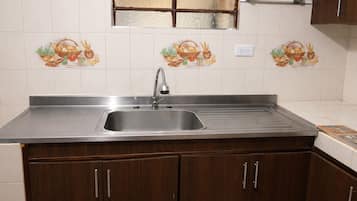 Fridge, stovetop, cookware/dishes/utensils, dining tables