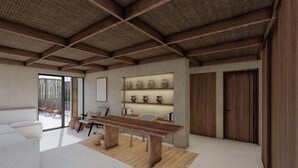 A modern interior with a wooden ceiling, a dining area with a table and chairs, a sofa, and a wall-mounted shelf with decorative items. - Hotel Boutique Alcalá Vallarta (Puerto Vallarta)