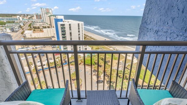 A balcony with a view of the ocean and cityscape. - Bluewater Resort 1501 (Myrtle Beach)