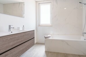 Shower, hair dryer, towels, toilet paper