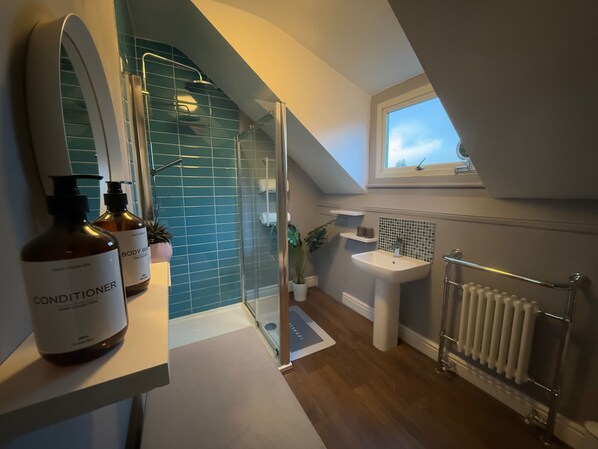 Shower, hair dryer, towels, soap