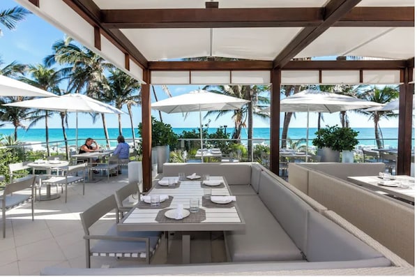 Outdoor dining - Fontainebleau Resort JR Suite Ocean View Resort Fee Included & 2 Spa Passes (Miami Beach)