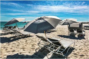 On the beach, sun loungers, beach towels