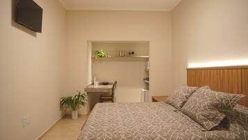 Double or Twin Room, Garden View | Minibar, desk, laptop workspace, iron/ironing board