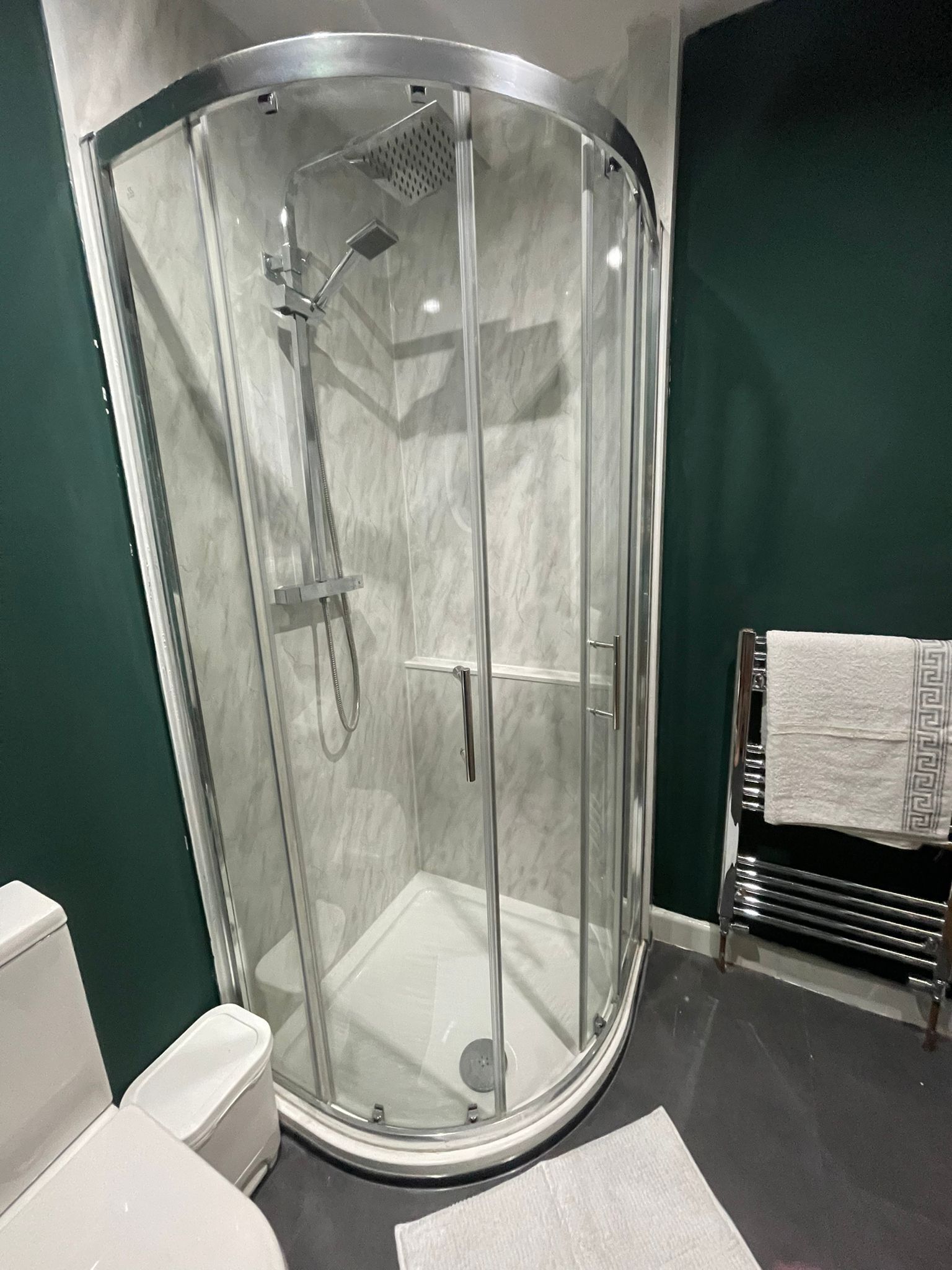 Shower, towels, soap, toilet paper