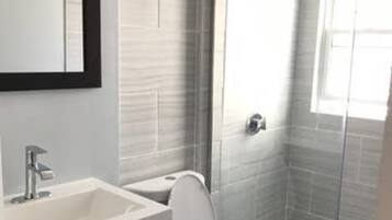 Shower, towels, soap, toilet paper