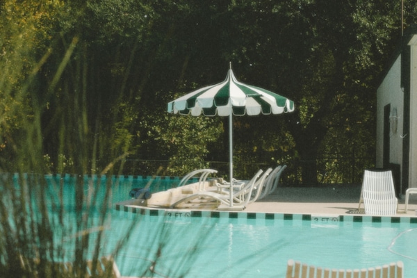 Seasonal outdoor pool, open 8:00 AM to 10:00 PM, pool loungers