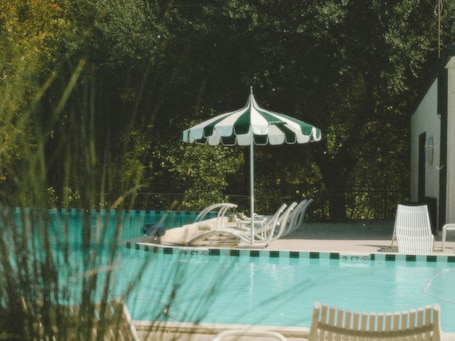 Seasonal outdoor pool, open 8:00 AM to 10:00 PM, sun loungers