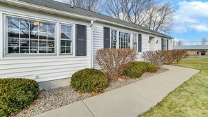 A single-story house with a front porch, large windows, and a gravel pathway. - 2 Mi to SUNY Cortland: Home Near Hiking & Golf! (Cortland)