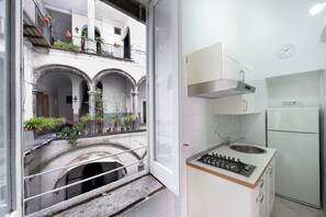 Fridge, microwave, stovetop, coffee/tea maker