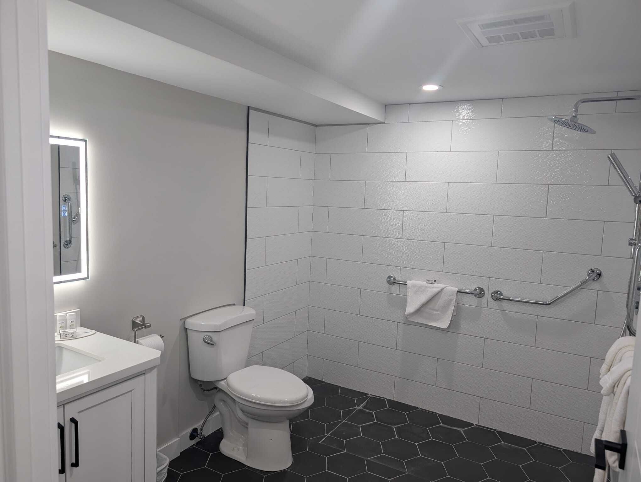 Superior Studio Suite | Bathroom | Shower, towels, soap, shampoo