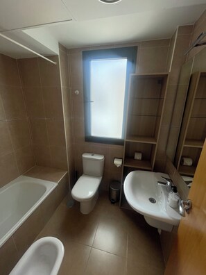 Hair dryer, bidet, towels, toilet paper