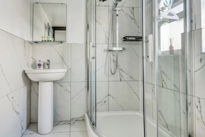 Shower, towels, toilet paper