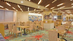 A spacious dining area with multiple tables and chairs, a patterned carpet, and a modern ceiling design. - Elong Hotel (Shenyang)