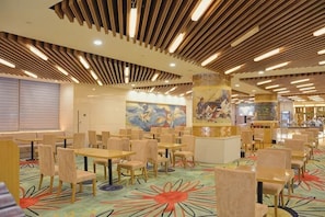A spacious dining area with multiple tables and chairs, a patterned carpet, and a modern ceiling design. - Elong Hotel (Shenyang)