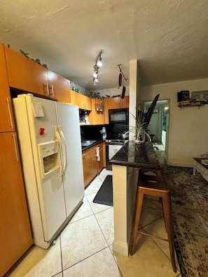 Fridge, microwave, oven, stovetop - Waterfront Condo with Fishing, Paddleboard, and yard access. (North Miami)