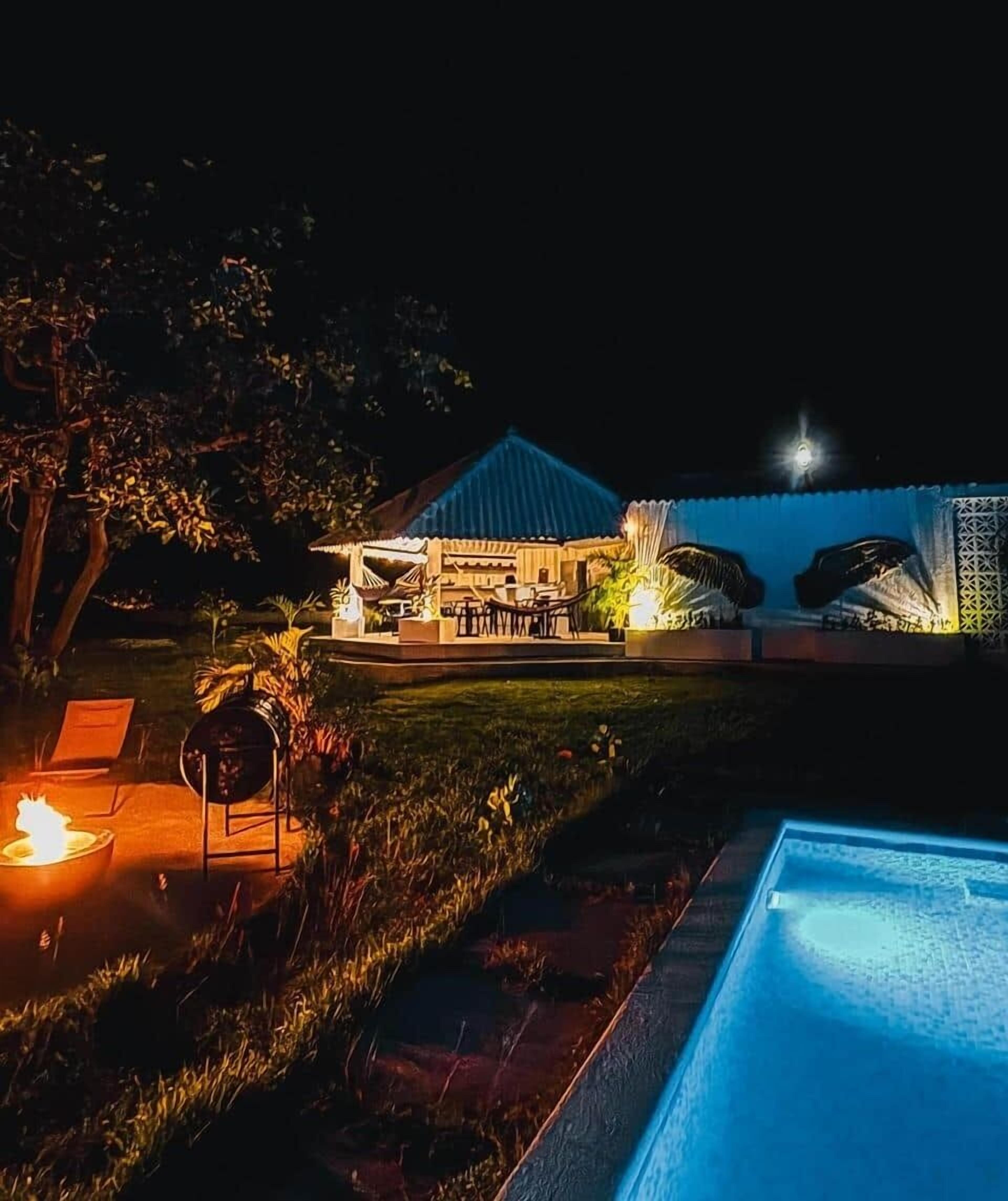 Night garden with pool → Stars dance above the glowing pool