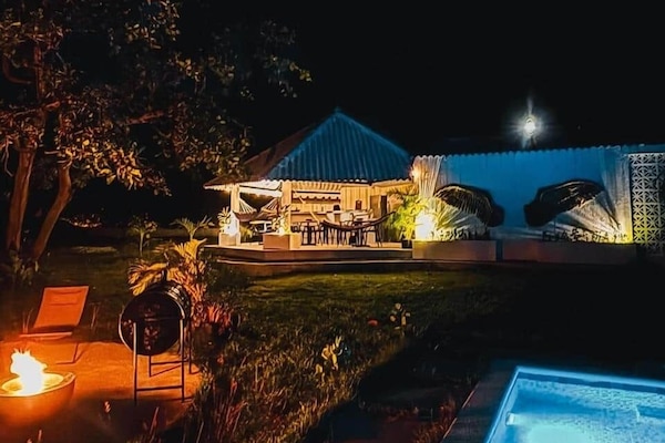 Night garden with pool → Stars dance above the glowing pool