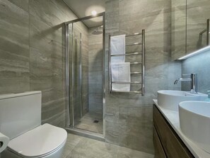 Shower, hair dryer, towels, soap