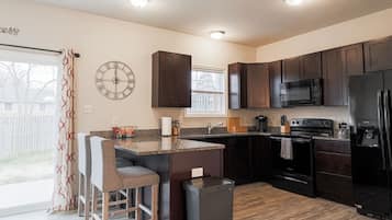 Fridge, coffee/tea maker, cookware/dishes/utensils