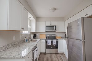 Fridge, coffee/tea maker, cookware/dishes/utensils