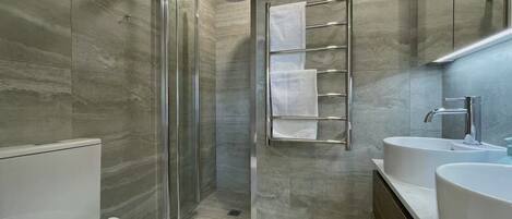 Shower, hair dryer, towels, soap