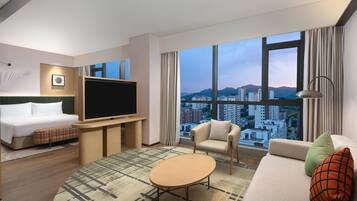 Deluxe kamer, 1 kingsize bed met slaapbank | Woonruimte