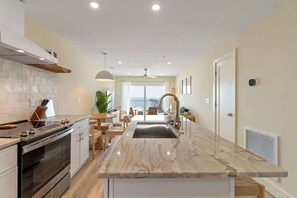 Fridge, microwave, oven, stovetop - Oceanside Oasis by Carolina Getaway - Oceanfront Condo POOL & HOT TUB OPEN (Carolina Beach)