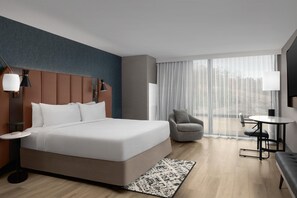 Premium bedding, desk, laptop workspace, blackout drapes