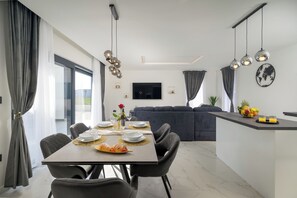 Enjoy casual dining in this stylish space with a flat-screen TV and comfortable seating for four.
