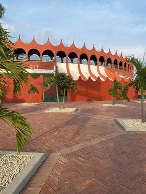 A building with a red brick facade and multiple arched windows.