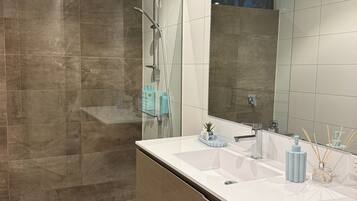 Shower, hair dryer, towels, soap