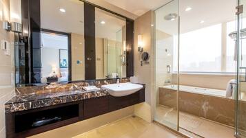 Luxury Single Room, City View | Bathroom | Hair dryer, slippers, towels, soap
