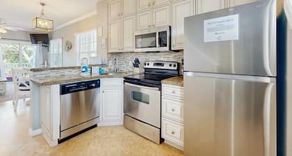 Charming townhome with ocean views, an open porch & steps from the water