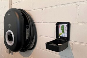 A self-service kiosk with a map display, a charging port, and a card reader. - Siebenstern**** Vacation Rental - 4-star vacation rental with high-speed Wi-Fi, balcony & (Winterberg)
