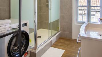 Shower, hair dryer, towels, soap
