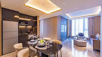 Luxury Suite, City View | Living area | LCD TV