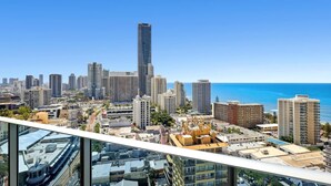 A high-rise building with a view of the ocean and other city buildings. - Modern 2-Bed with Pool Access in Surfers Paradise (Surfers Paradise)