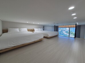A modern hotel room with two beds, a large window with a view, and recessed ceiling lighting. - Diamer Hotel Yangyang By Stayneo (Yangyang)