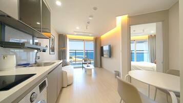 Premier Suite B | Living room | 55-inch Smart TV with cable channels, Netflix, pay movies