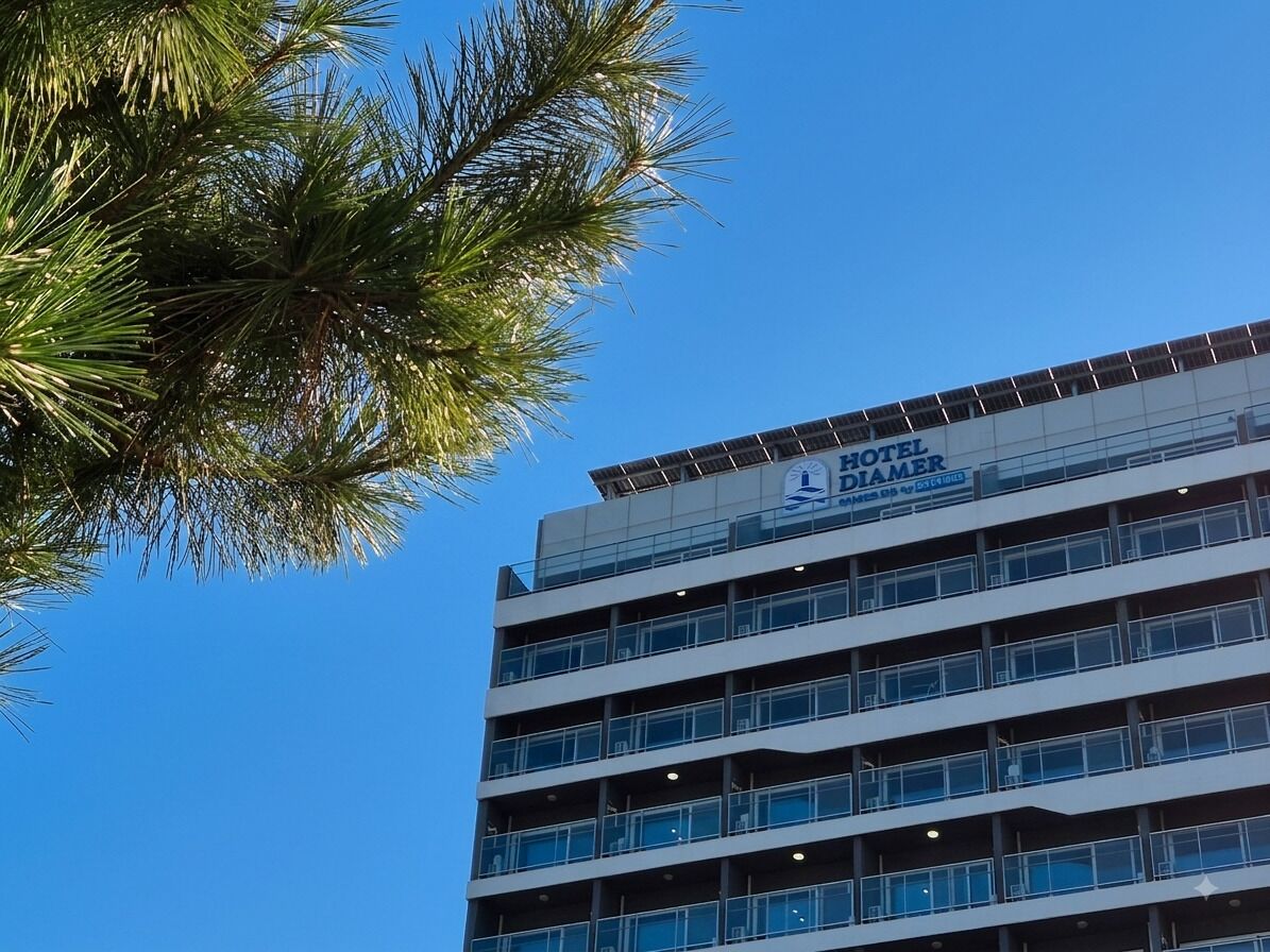 A multi-story hotel building with a sign indicating it is a hotel.