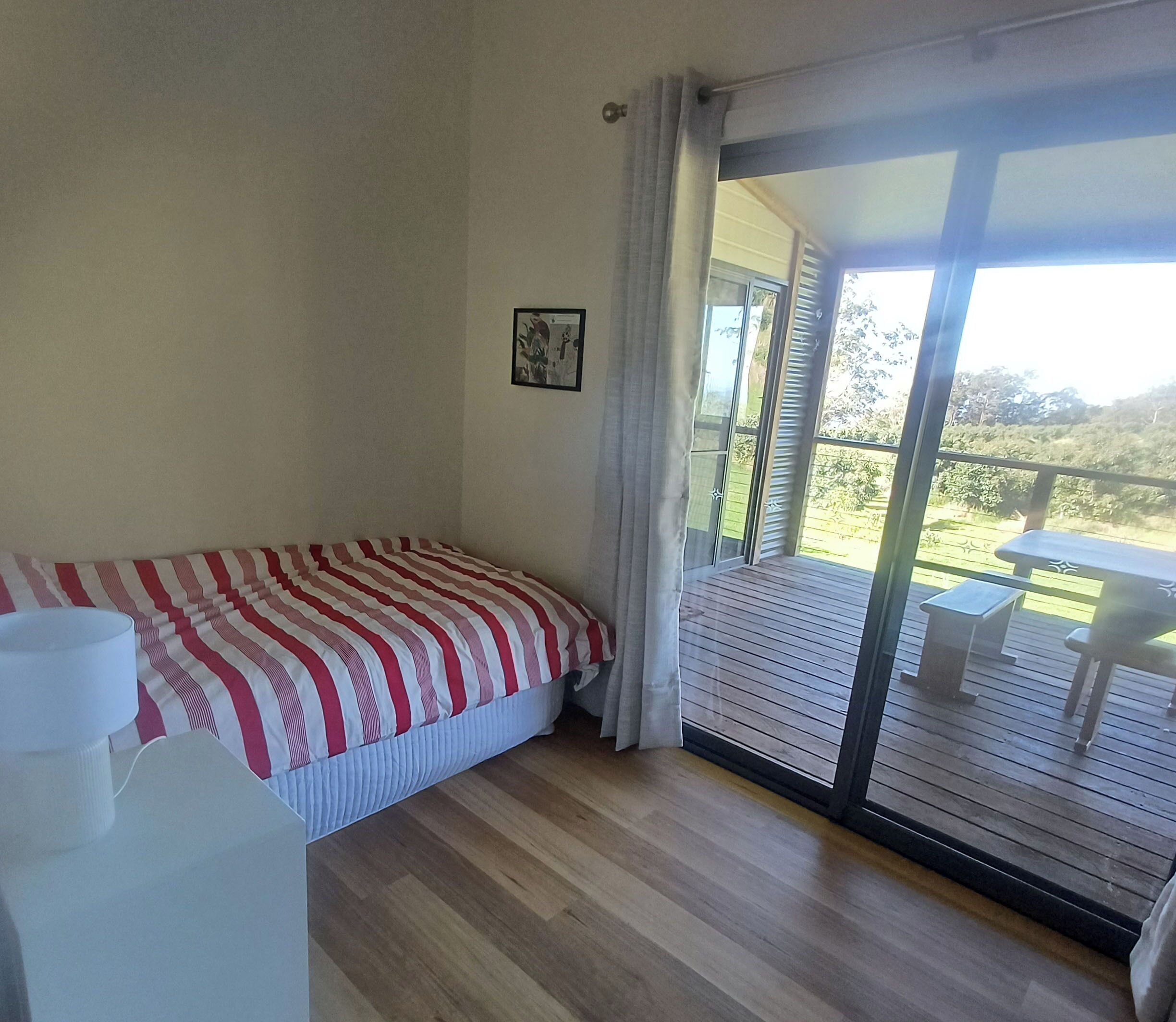Bedroom 4 - with two single beds, opening onto verandah with rural views 