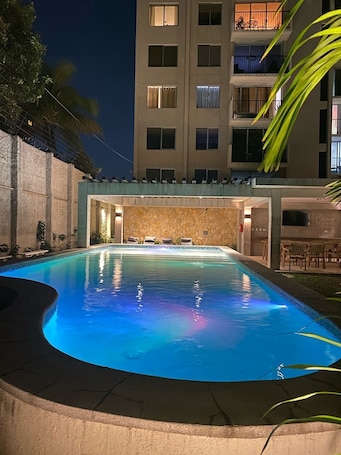Outdoor pool. Spacious Modern and Cozy Apartment with Pool and Gym