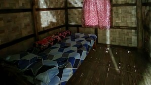 A room with a bed, a window with a curtain, and wooden walls. - Warichora Homestay and Rooms Meghalaya (South Garo Hills)