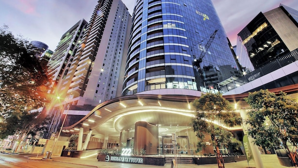A modern hotel with a curved entrance, multiple floors, and a prominent sign indicating the name. - Horizon Haven with Panorama view with Free parking (Brisbane City)
