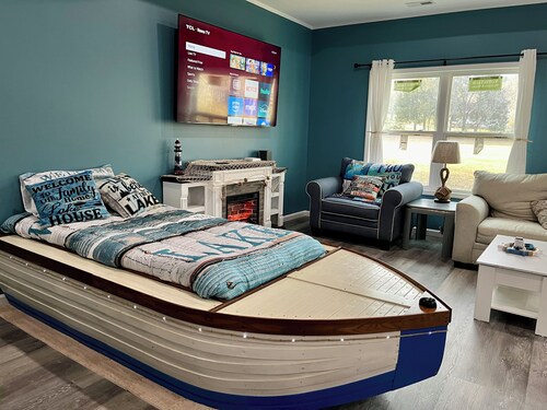 Beautiful new construction lake themed lake house with gameroom and boat bar.