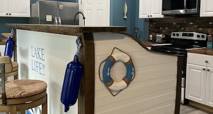 Beautiful new construction lake themed lake house with gameroom and boat bar.